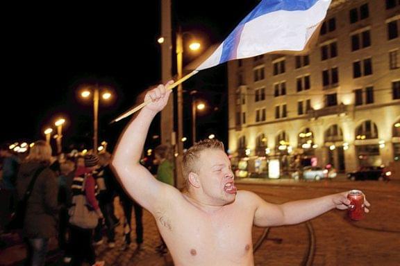 "A drunken naked man full of national pride running with a Finnish flag and a can of beer"